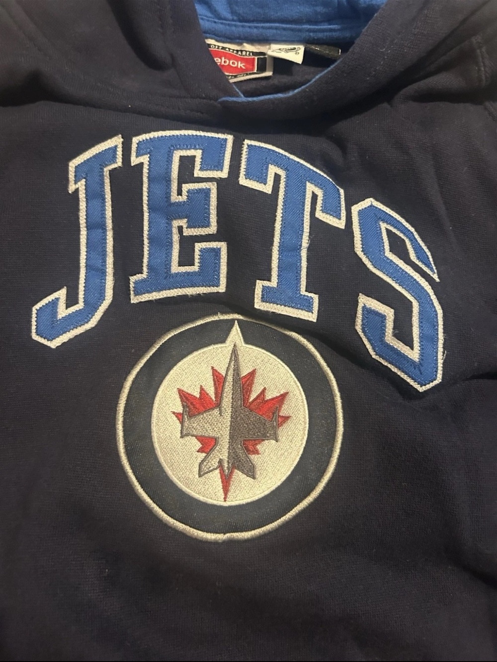 Reebok Men’s Navy Winnipeg Jets Pullover Hoodie with Blue and Red Logo